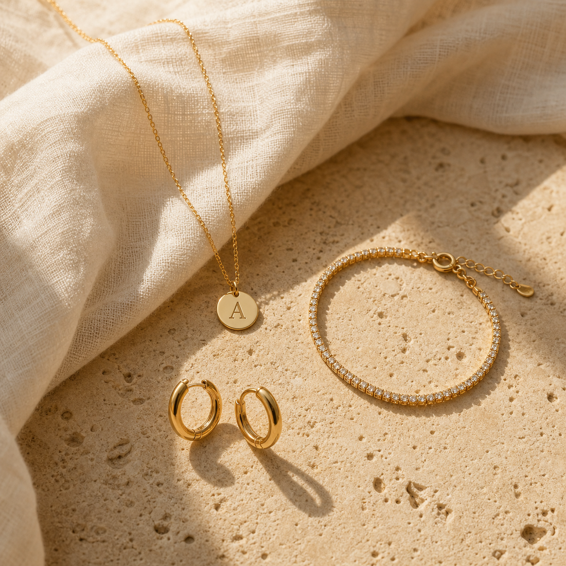 Gold initial necklace styled with delicate jewellery