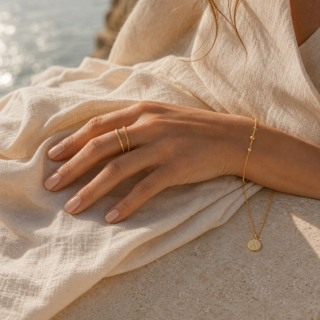 Delicate gold jewellery styled in Mediterranean light